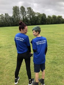 Kimberley and Bobby-Jack Spencer-Sallis modelling their 'parkrun to the Paralympics' t-shirts at Winchester parkrun