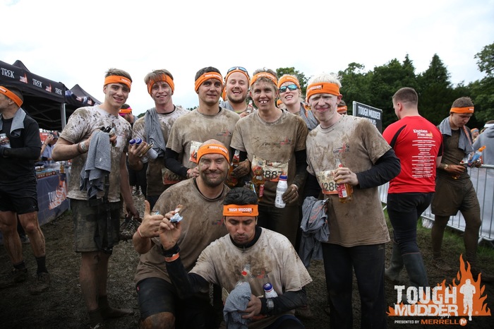 The Tough Mudder participants stood together after the race, in their Goalball UK T-shirts covered in mud