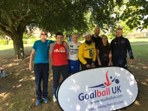 Image shows members of the Goalball Family stood together at a park run.