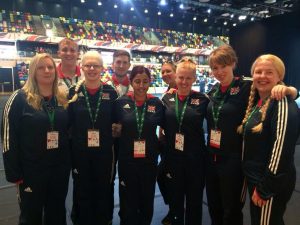 Image is of the Team GB women's goalball squad stood for a photo at the National Paralympic day celebration