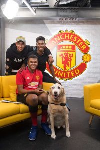 Image shows Rainbow sat down with Marcus Rashford and Jesse Lingard after meeting them