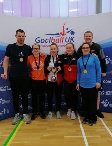 RNC team photo after winning gold in the intermediate finals with a predominantly women's team. Aaron Ford is in the far right.