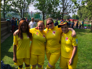 Reanne Racktoo stood in a group photo in yellow football kit at the England at the 1st ever IBSA Women’s Blind Football tournament in Austria in 2017.