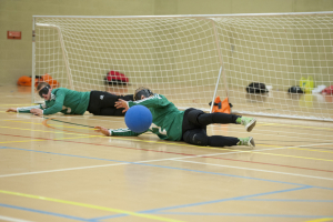 Image of a Goalball player blocking