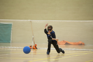 Image of a Goalball player in front of goal