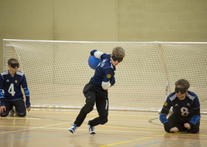 Image of a Goalball player on the attack