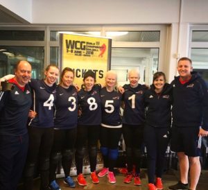 Group photo of GB Women and coaches smiling