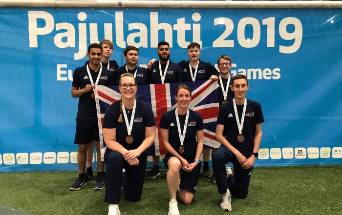 Group photo of GB Under 23 players and coaching staff, with the Union Flag
