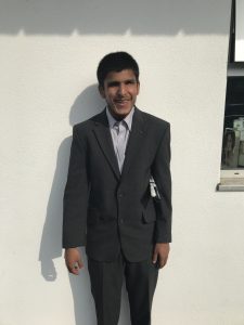 Profile of Yusuf, dressed in a smart suit!