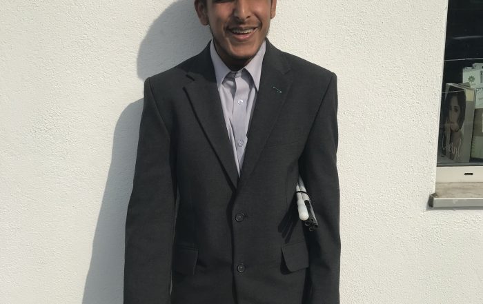 Profile of Yusuf, dressed in a smart suit!