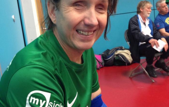 Sarah in her goalball kit, smiling
