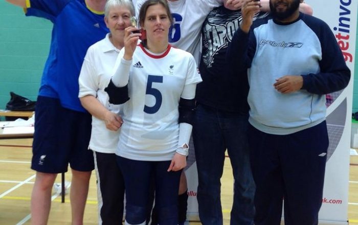The winning team from the first pool holding their trophies