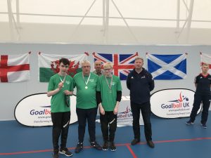The Northern Ireland Goalball team, including James, collecting their medals at the 2018 Home Nations Tournament