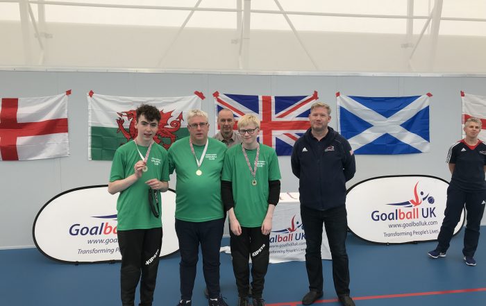 The Northern Ireland Goalball team, including James, collecting their medals at the 2018 Home Nations Tournament