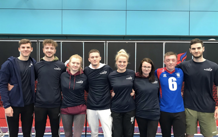 group photo of the volunteers who attended a recent goalball tournament