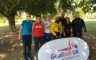 Image shows members of the Goalball Family stood together at a park run.