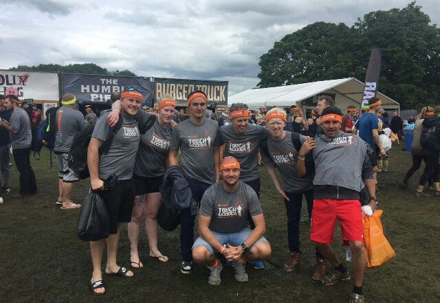 The Tough-Mudder participants stood together for a photo before the race