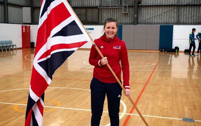 Becky smiling holding the Union Flag