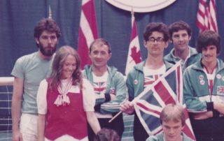 Image shows the GB Men's team at the 1982 world championships in the USA holding a Union Jack