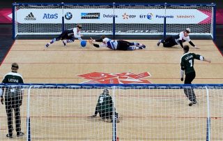 Image shows Great Britain's Michael Sharkey (left), Niall Graham and Adam Knott (right) in action against Lithuania during the Mens's Goalball at the Copper Box in London.