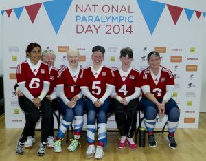 Image is of Team GB goalball players at the 2014 National Paralympic Day celebration