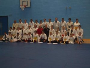 Image shows Megan with a group with her martial arts group