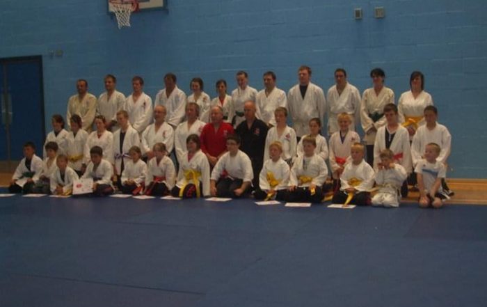 Image shows Megan with a group with her martial arts group