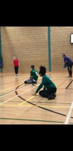 Aneesah in the goalball ready position mid match.