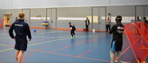 Goalball UK National Talent Camp 2019. This image shows Tom Dobson looking onto a goalball game.