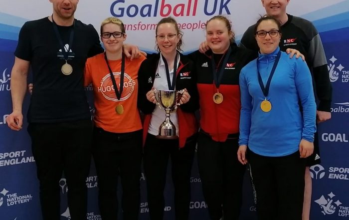 RNC team photo after winning gold in the intermediate finals with a predominantly women's team. Aaron Ford is in the far right.