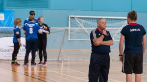 Robert Avery and Chris Davies talking at half time of a goalball game.