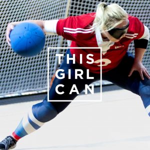 This girl can advertisement. It shows a female goalball player just about to shoot with the this girl can logo in front of her.