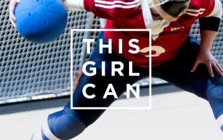 This girl can advertisement. It shows a female goalball player just about to shoot with the this girl can logo in front of her.