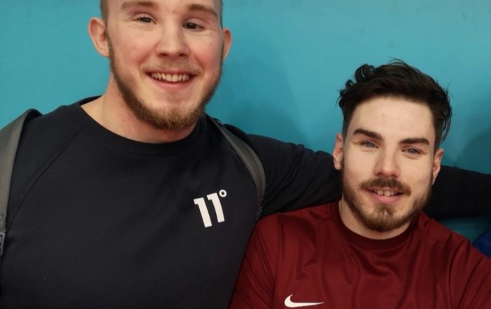 Josh McEntee and Josh Windle posing for a photo together.