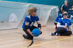 Warren Wilson mid Goalball game just standing up and about to throw.