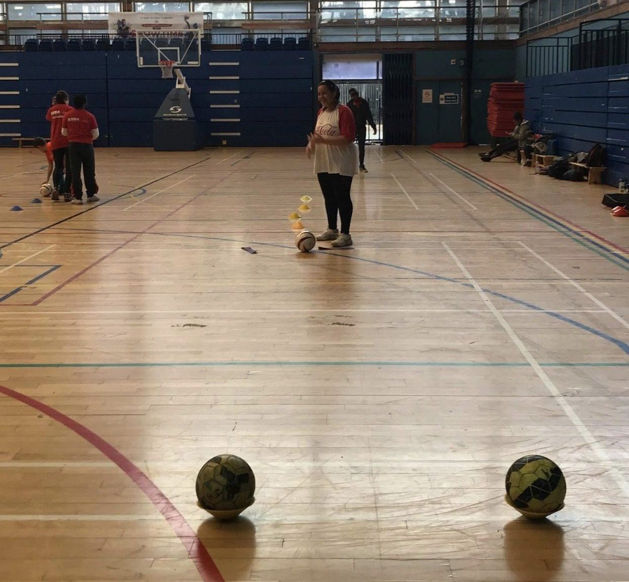 Action shot of Alex playing goalball!