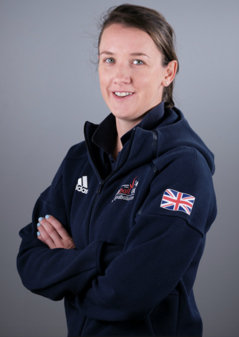 Image shows Faye stood smiling at the camera in her GB jacket with her arms crossed
