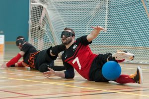 Dave Butler action shot, diving to save a shot