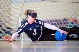 Action shot of Georgie Bullen playing goalball in her GB womens kit