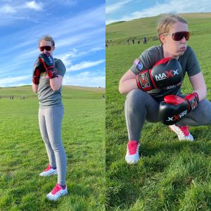 Two images, one of Georgie stood in a boxing stance with her boxing gloves on and the other of her crouched down with her boxing gloves on.