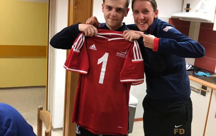 A proud moment for Jack holding his GB top with Head Coach Faye Dale.