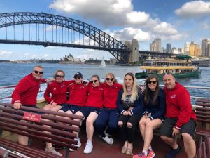 Image shows Nansi sat on a boat with her GB teammates and coaches