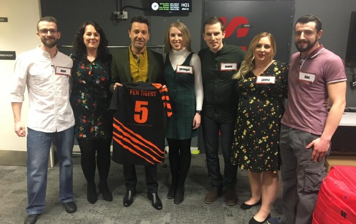 Fen Tigers team on Gino D/Acampo's Win Your Wish List holding a Fen Tigers shirt