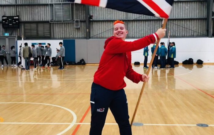Meme Robertson waiving the Great Britain flag at the 2019 Under 19 World Championships!