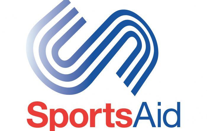 SportsAid logo with the word sport in red and aid in blue with an S above in the design of a running track.