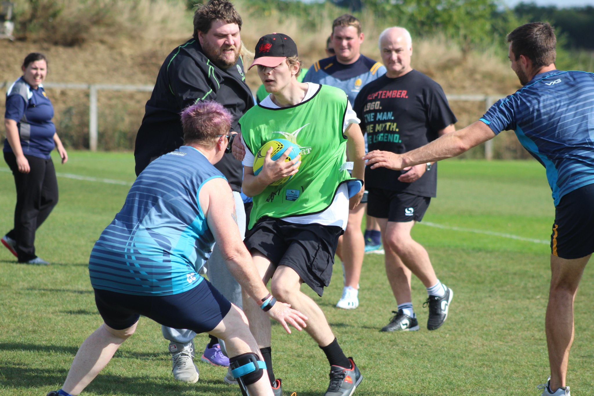 A picture of a rugby game with the player closest preparing to tackle an oncoming player which is Tom Lancaster