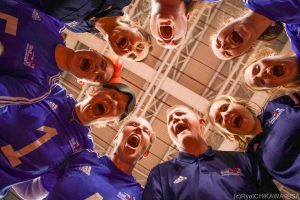 GB team celebrating after a win in a team huddle!