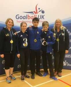 Team photo of a Winchester team at a Goalball UK tournament. Wearing medals of course!