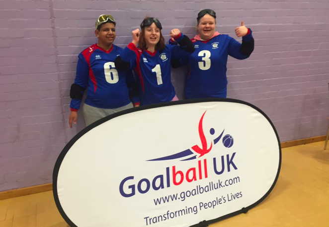 Group photo of 3 South Yorkshire players in front of a Goalball UK banner.
