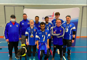 Birmingham Goalball Club group photo with all players and coaches stood together wearing their Birmingham jackets.